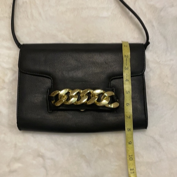 H & M black crossbody with bold gold chain front accent. - Picture 10 of 11